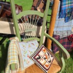 Green wooden chair and cushions